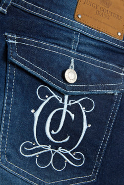 Displays the Mid Wash Juicy Couture branded crest booty denim shorts featuring the juicy logo