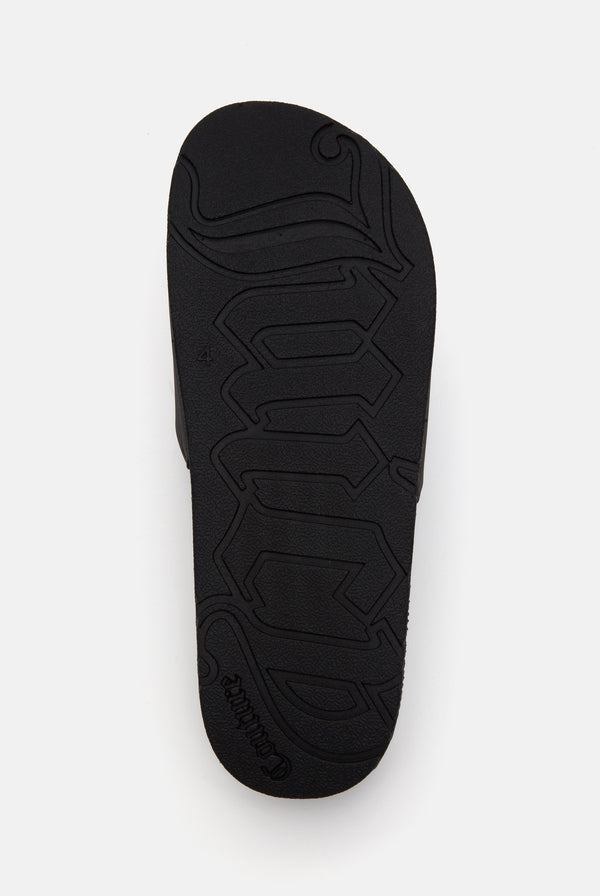 Displays the sole of the Black 'juicy' branded stacked embossed slider