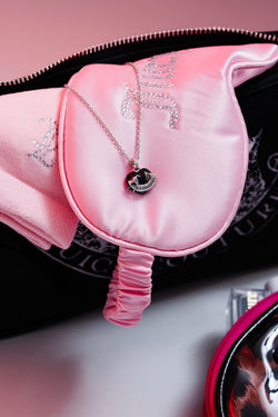 Displays some Juicy products including the handbag featuring the 'Juicy' Silver Tone Enamel Icon Heart Pendant