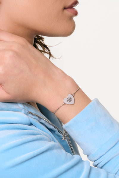 SILVER TONE JUICY COUTURE REVERSIBLE HEART ADJUSTABLE BRACELET