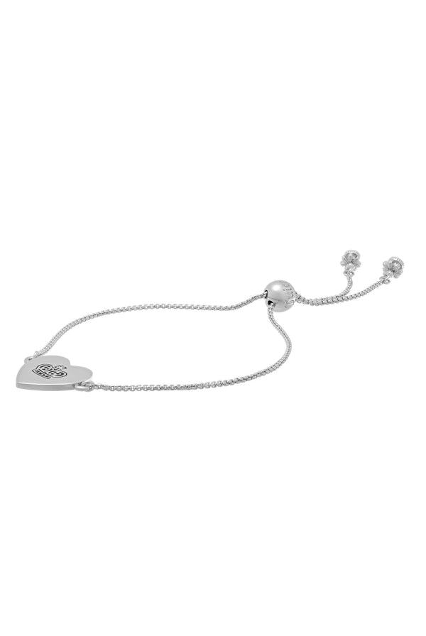 Displays the silver tone 'Juicy' branded reversible heart adjustable bracelet 