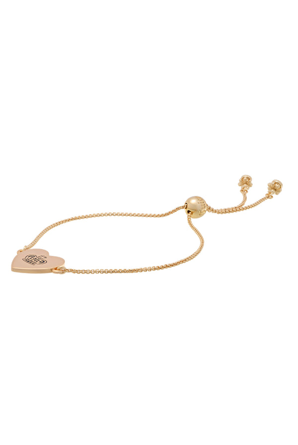 Displays the gold tone 'Juicy' branded juicy Couture reversible heart adjustable bracelet 