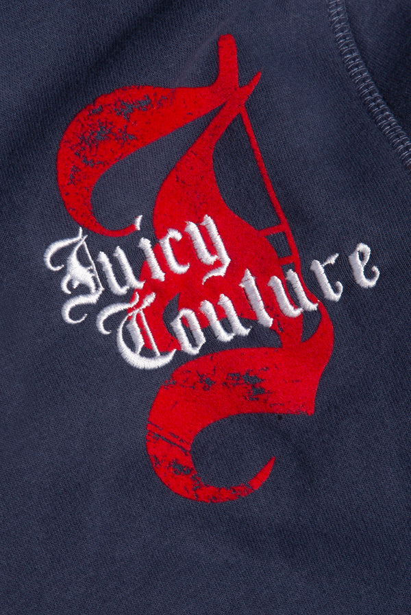 Displays a model wearing the Mood indigo 'juicy' branded longline fleece zip through hoodie featuring the juicy Couture logo