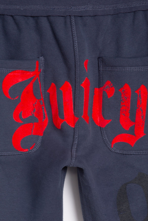 Displays the Mood indigo relaxed fit 'juicy' branded flare fleece track pant featuring the juicy branding 
