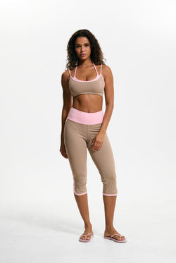 Displays a model wearing the Fungi 'Juicy' branded Sport Contrast Capris