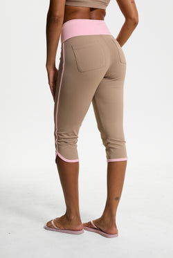 Displays a model wearing the Fungi 'Juicy' branded Sport Contrast Capris