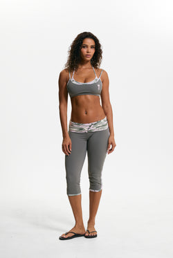 Displays a model wearing the Thyme 'Juicy' branded Sport Contrast Capris