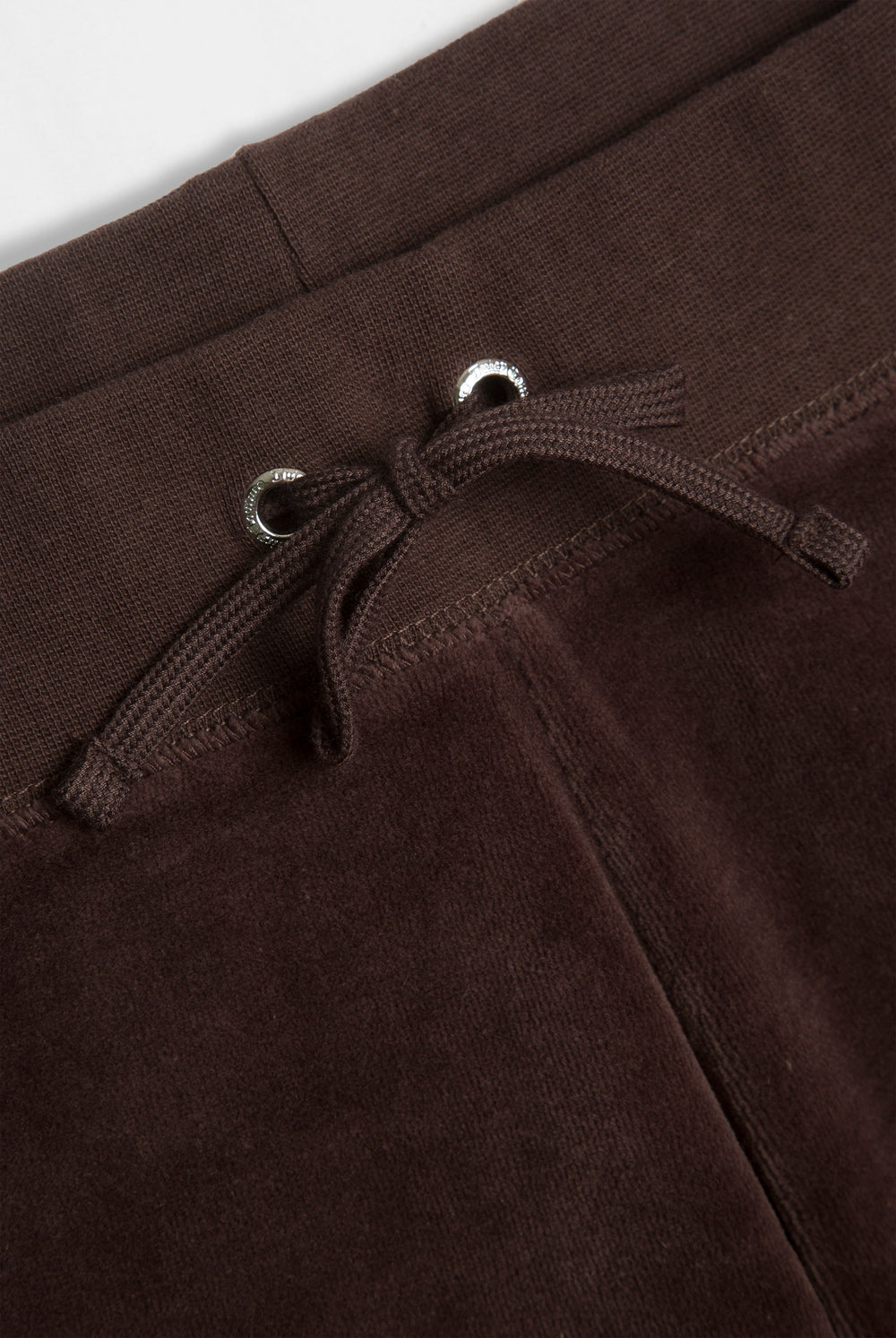 Displays the Java 'Juicy' branded OG straight pocketed capri pants featuring the close up on the details 