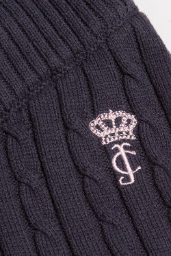 Displays the Night Sky 'Juicy' branded Cable Knit Straight Leg Pants featuring the close up on the juicy branding 
