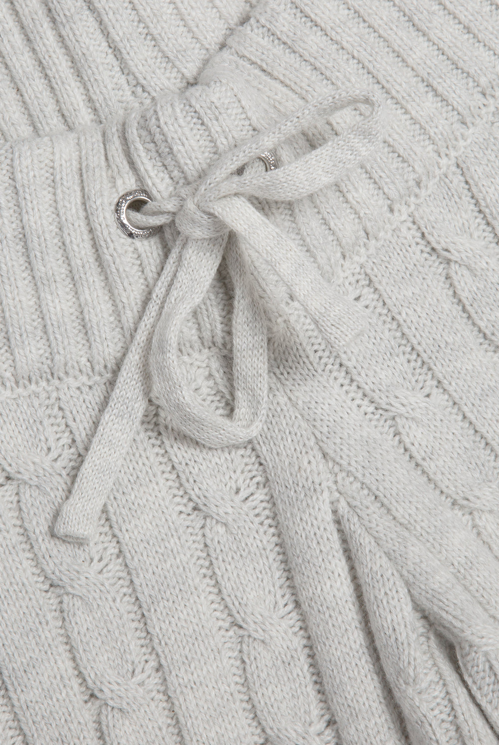 Displays the Silver Marl 'Juicy' branded Cable Knit Straight Leg Pants featuring a close up on the straw stings 