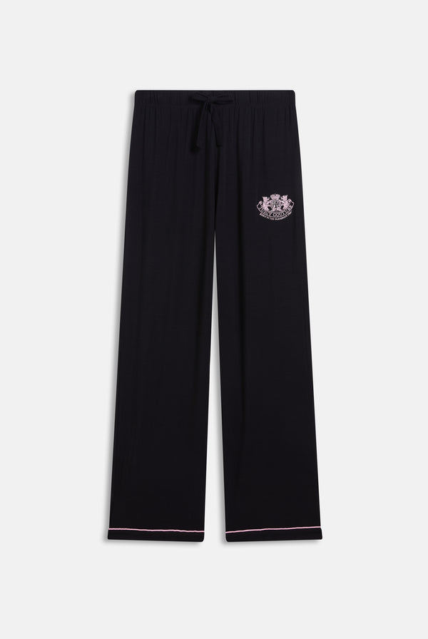 Displays the Black 'Juicy' branded Juicy Dog crest bottoms included in the pyjama set 