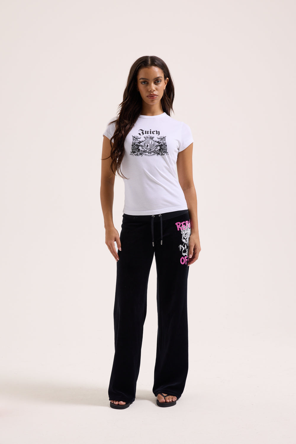 Displays a model wearing the White 'Juicy' branded Dog Crest graphic tee 