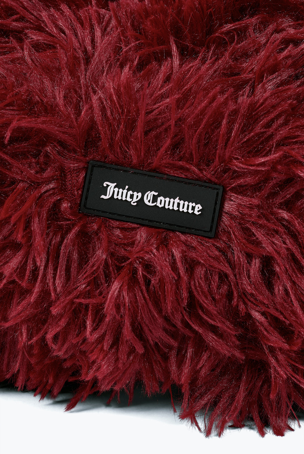 Displays the Winetasting 'Juicy' branded Fluffy Heart Pet Bed featuring the details on the juicy Couture branding 