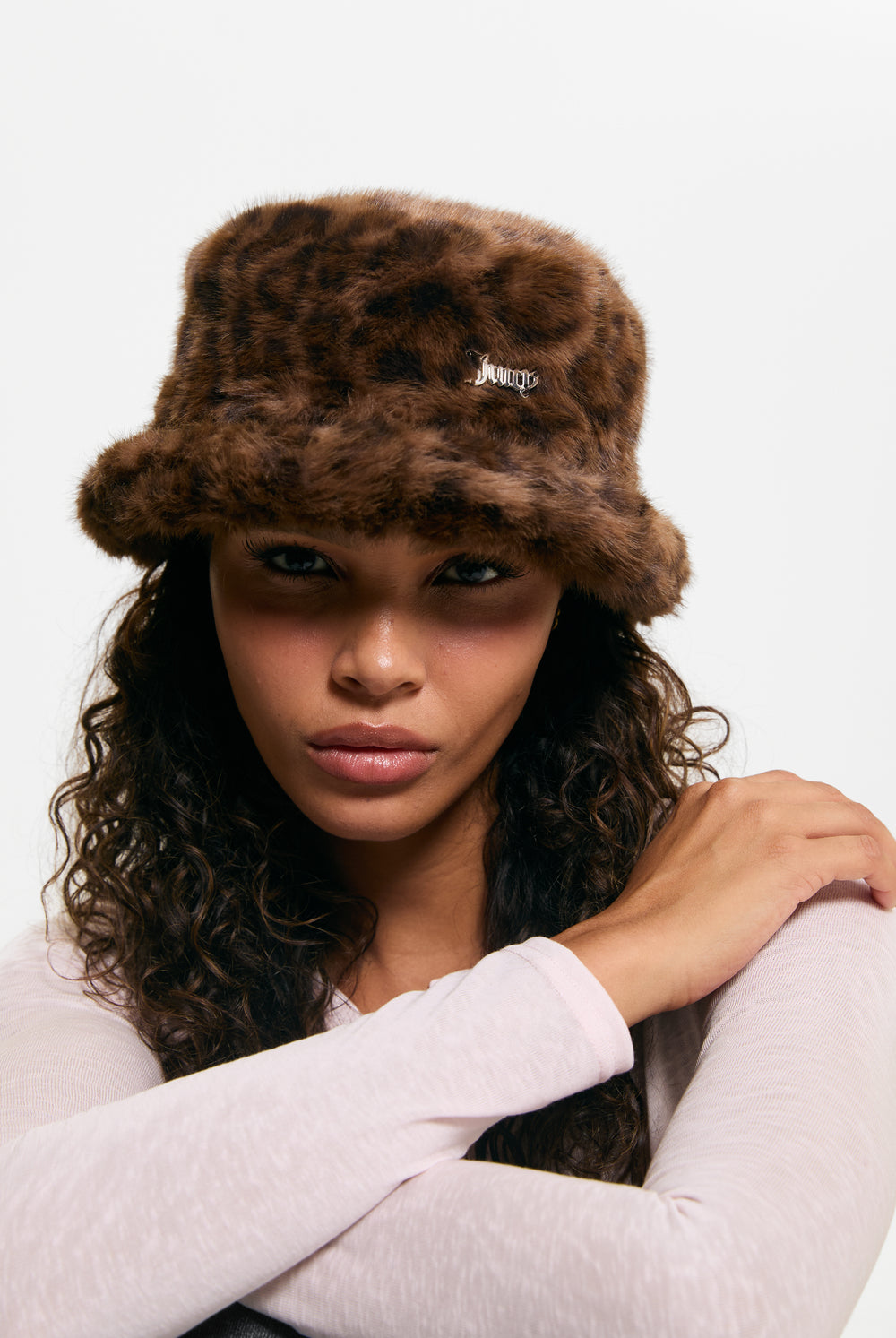 Displays a model wearing the Leopard Print 'Juicy' branded Plaque Fur Bucket Hat