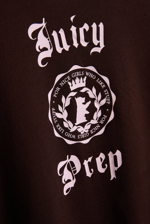 Displays a model wearing the Java 'Juicy' branded tee included in the pyjama set featuring the juicy branding 