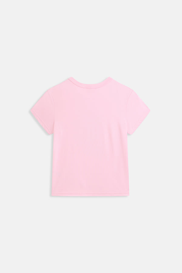 Displays a model wearing the Juicy Pink 'Juicy' branded prep tee 