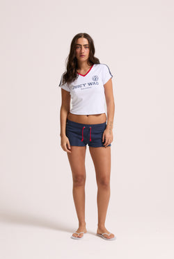 Displays a model wearing the White 'Juicy' branded Juicy Wag V Neck T-Shirt 