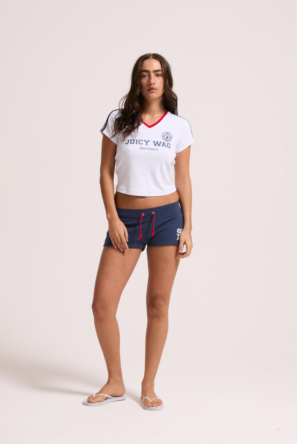 Displays a model wearing the White 'Juicy' branded Juicy Wag V Neck T-Shirt 