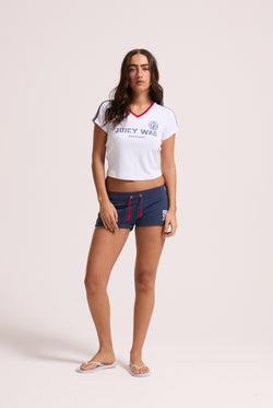 Displays a model wearing the White 'Juicy' branded Juicy Wag V Neck T-Shirt 