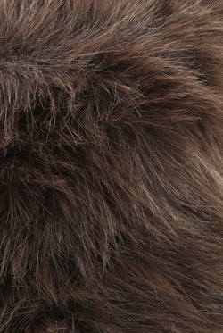 Displays the Java 'juicy' branded Plaque Fur Bucket Hat featuring the close up on the details