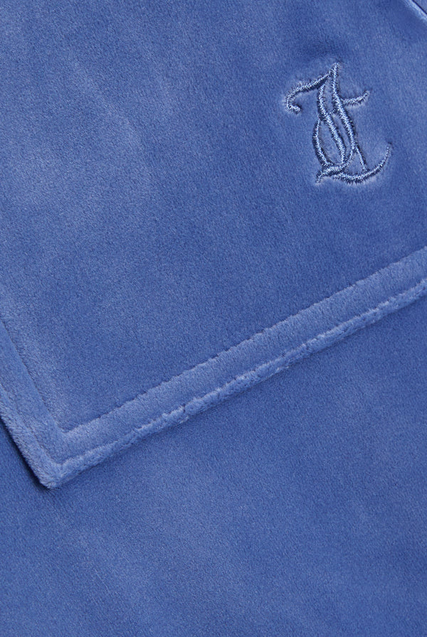 Displays the Grey&blue 'Juicy' branded Low Rise Flare Classic Velour Track Pant featuring the juicy couture branding