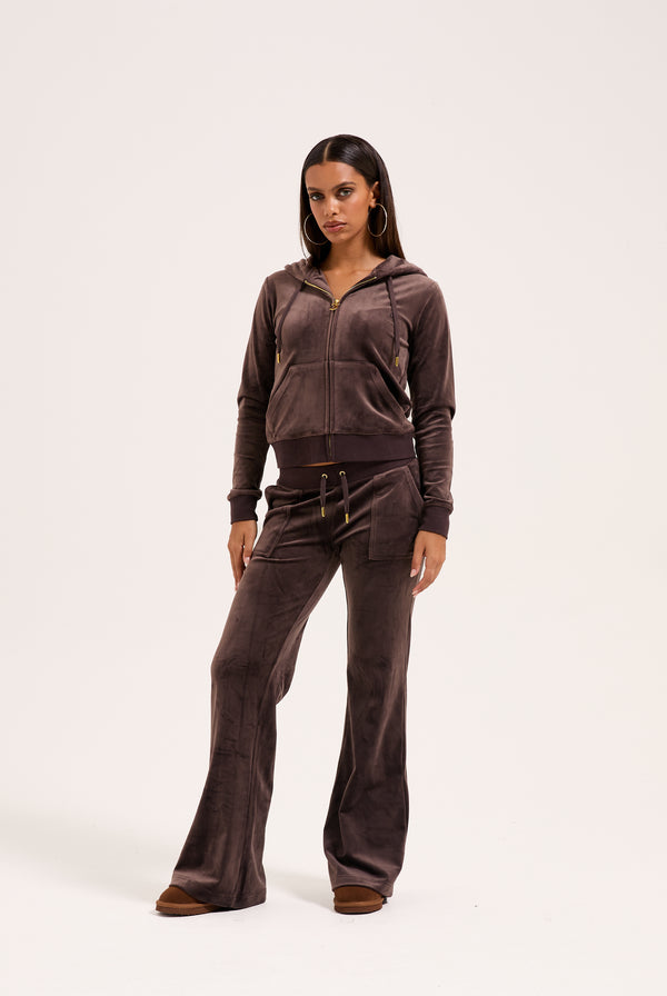Displays the model wearing the Java & Gold 'Juicy' branded classic velour Robertson hoodie 