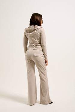 Displays a model wearing the string classic 'juicy' branded velour Robertson hoodie 
