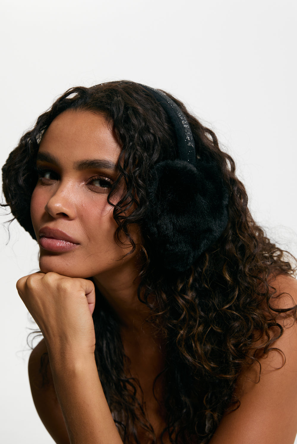 Displays a model wearing the Black 'Juicy' branded Long Fur Heart Shape Ear Muffs