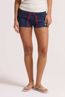 Displays a model wearing the Mood Indigo 'Juicy' branded fleece booty shorts 