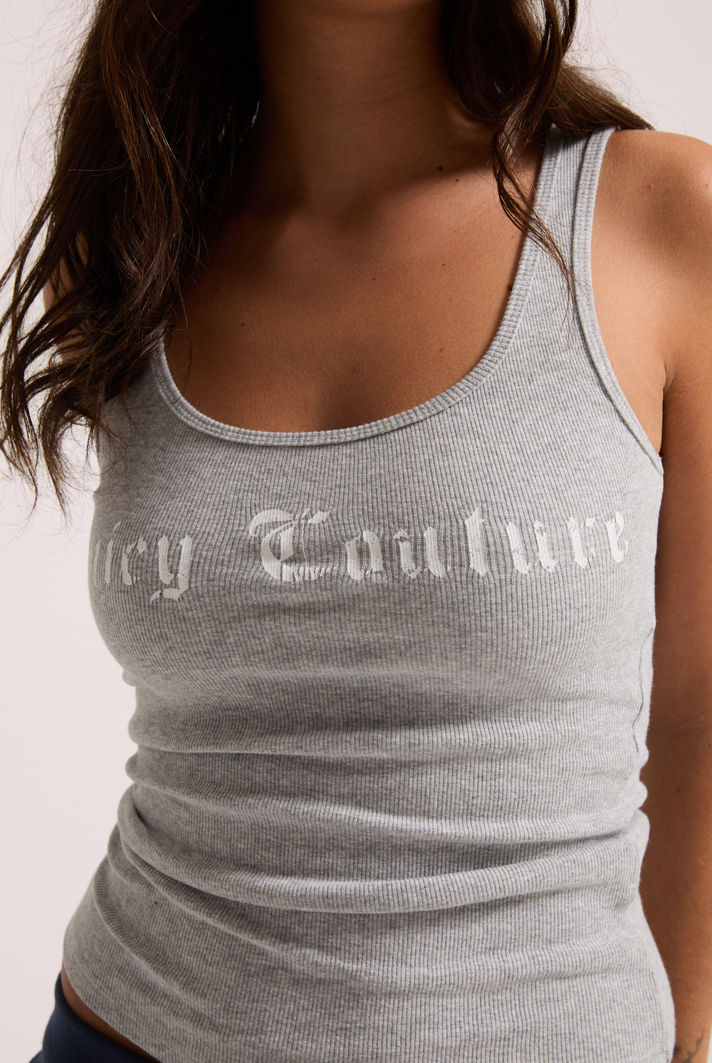 Displays a model wearing the Silver Marl 'Juicy' branded longline ribbed vest 