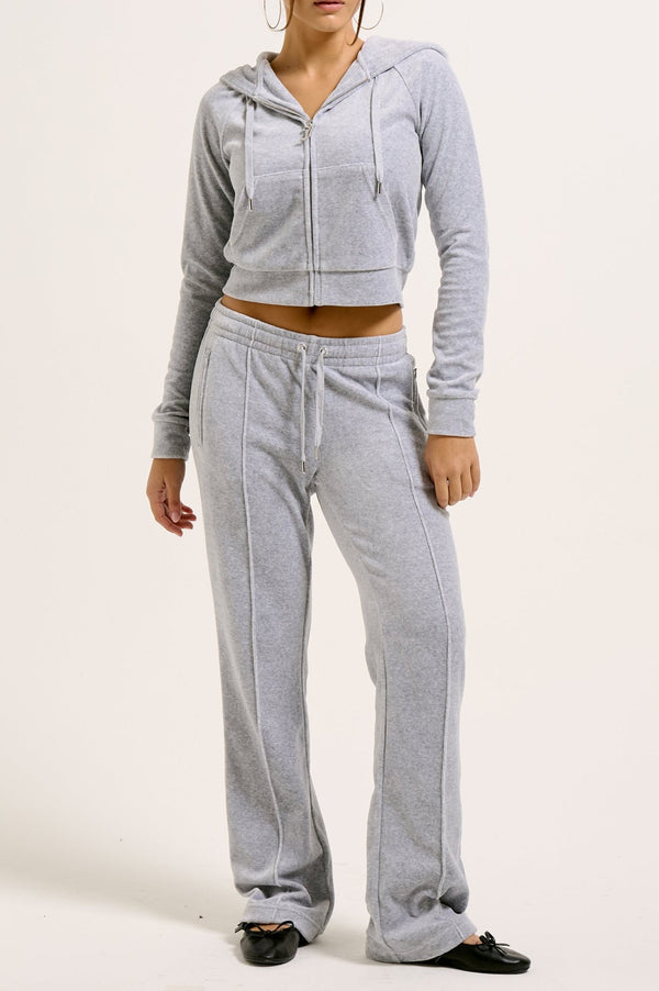 Displays a model wearing the Silver Marl Diamanté 'Juicy' branded cotton velour zip-through hoodie