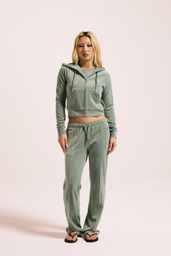 Displays a model wearing the Chinois Green 'Juicy' branded diamanté velour zip-through hoodie 