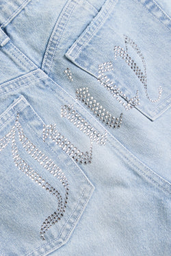 Displays the Light Wash 'Juicy' branded Diamanté bootcut jeans featuring the juicy branding