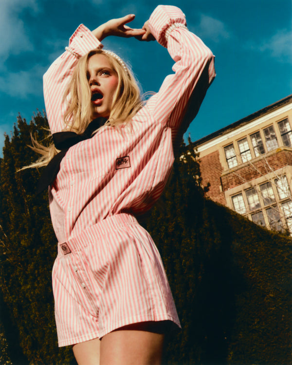 Displays a model wearing the White Striped 'Juicy' branded boxer short included in the pyjama set