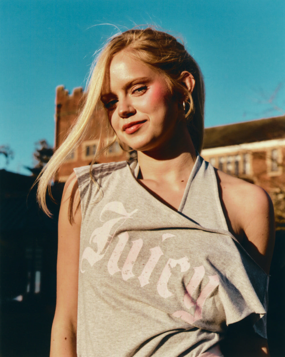 Displays a model wearing the Silver Marl 'Juicy' branded off the shoulder T-Shirt 