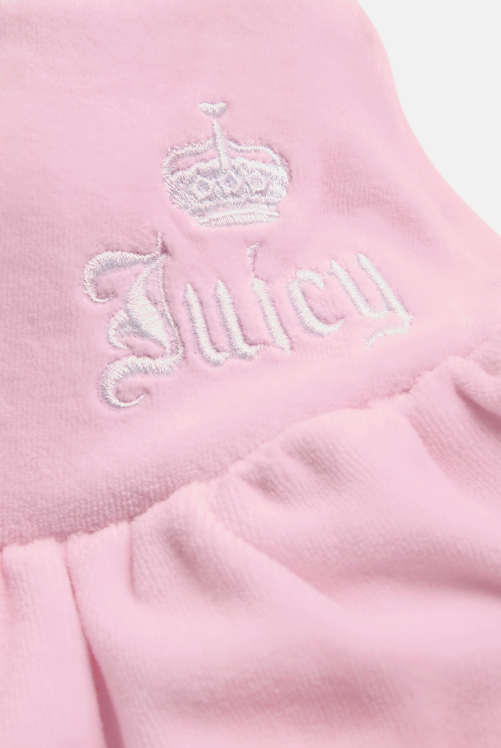 Displays the Cherry Blossom 'Juicy' branded Cotton Velour Ruffle Skirt featuring the details on the juicy branding 