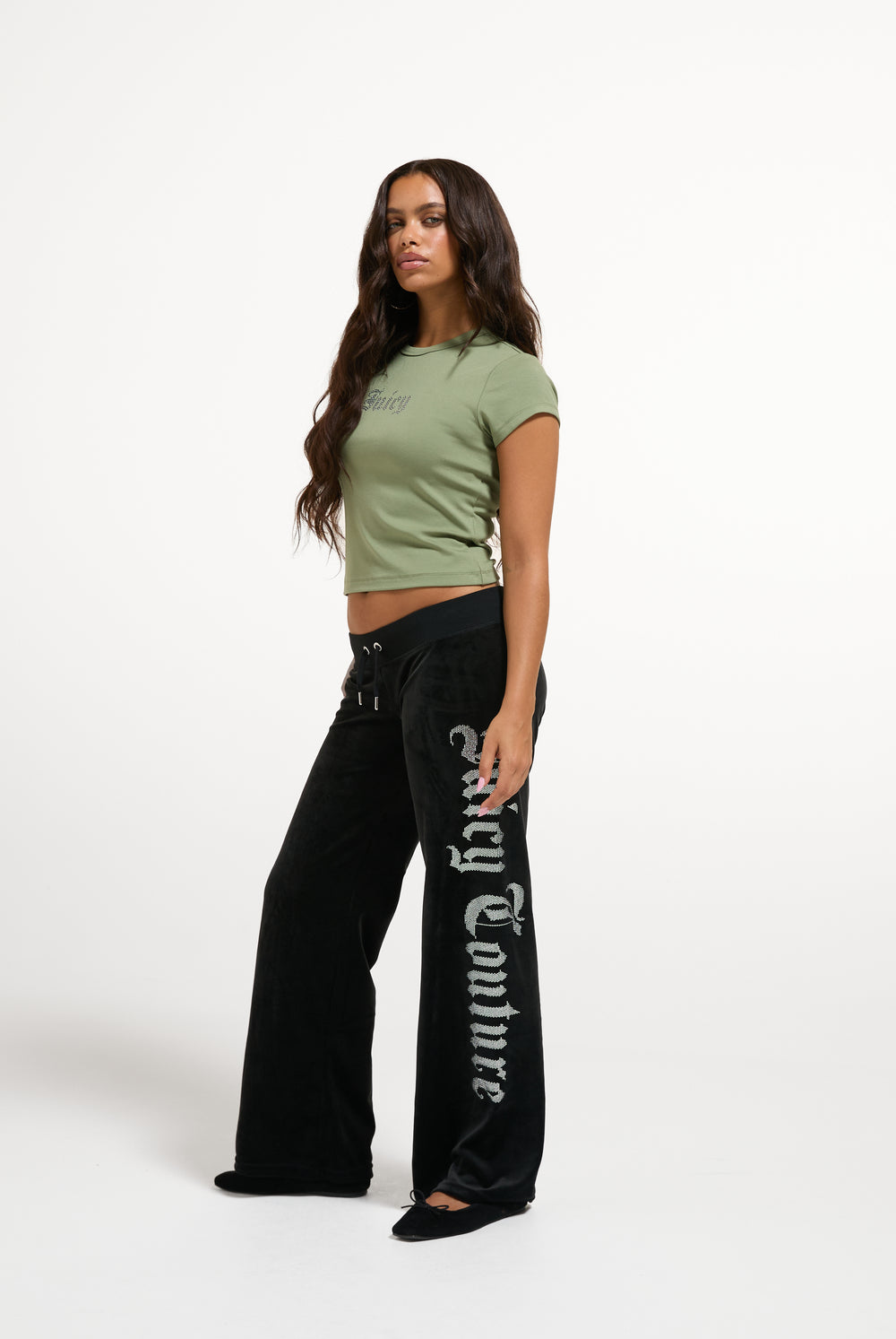 Displays a model wearing the Oil Green 'Juicy' branded Old Gothic Baby T-Shirt