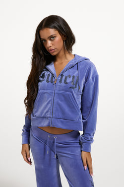 Displays a model wearing Greyblue 'Juicy' branded Old Gothic Oversized Cropped Hoodie