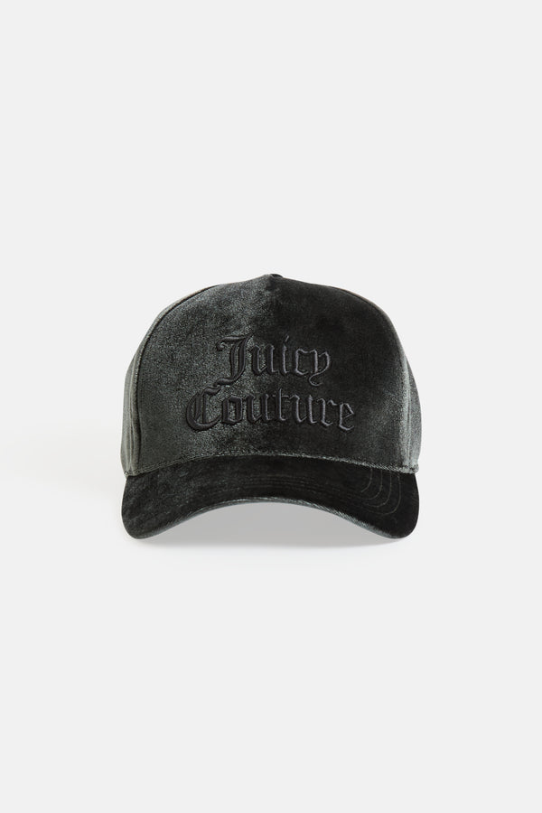 Displays the green 'juicy' branded velour juicy couture cap 