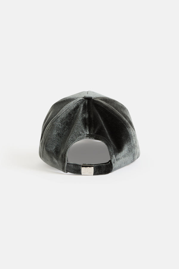 Displays the green 'juicy' branded velour juicy couture cap 