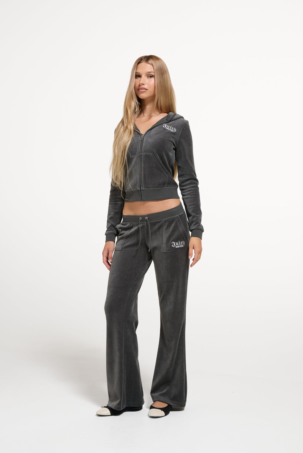 Displays a model wearing the Raven 'Juicy' branded Regal Rebelle Caisa Ultra Low Rise Pant