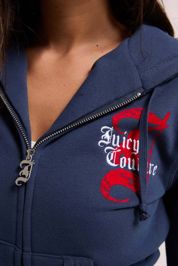 Displays a model wearing the Mood indigo 'juicy' branded longline fleece zip through hoodie 
