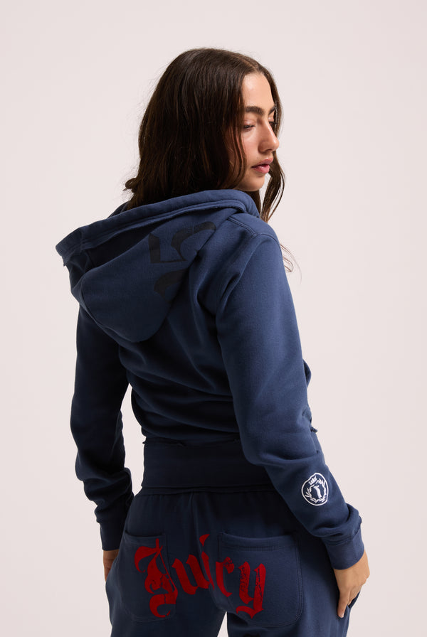 Displays a model wearing the Mood indigo 'juicy' branded longline fleece zip through hoodie 