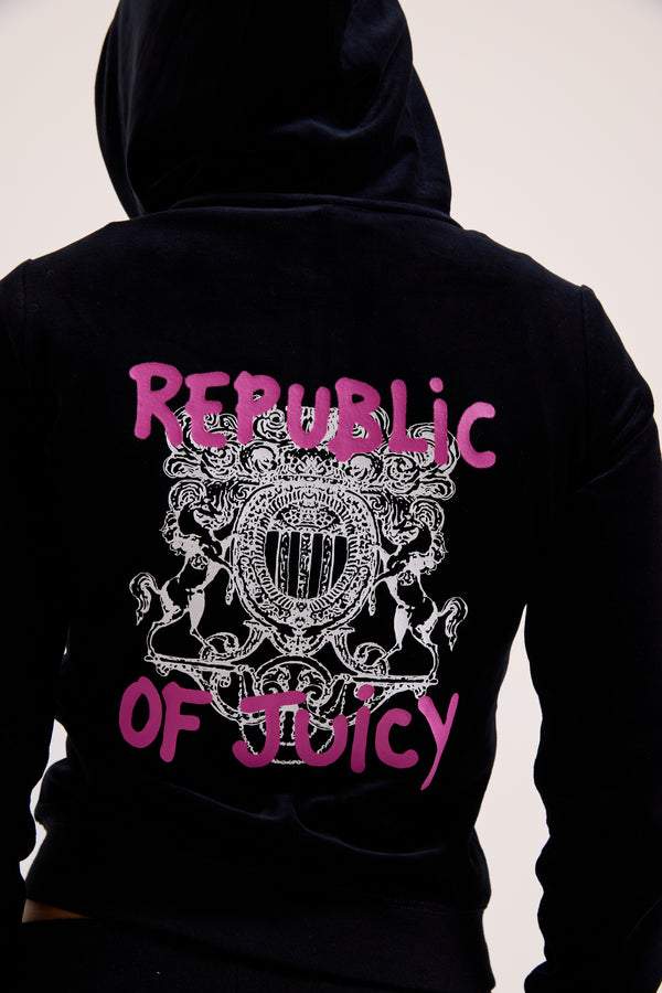 Displays a model wearing the Black Juicy Couture & Roxy Republic of heritage hoodie 