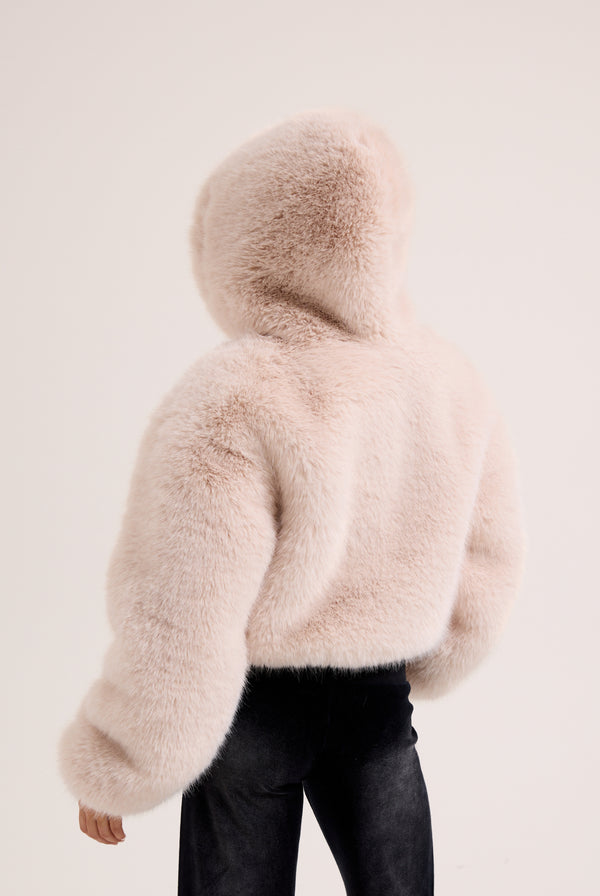 Display the cream hooded 'Juicy' branded faux fur jacket 