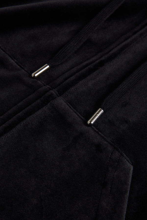 Close up of a black velour hoodie