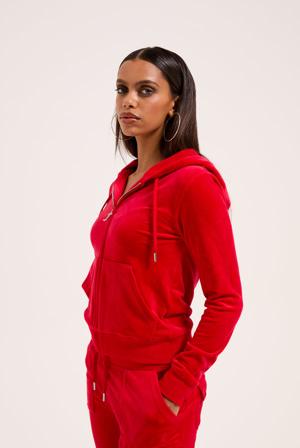 Displays a model wearing the Toreador 'Juicy' branded classic velour Robertson hoodie 