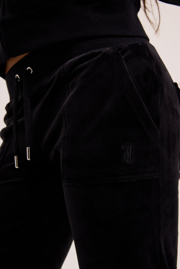 Black pants with drawstring waistband on a plain background