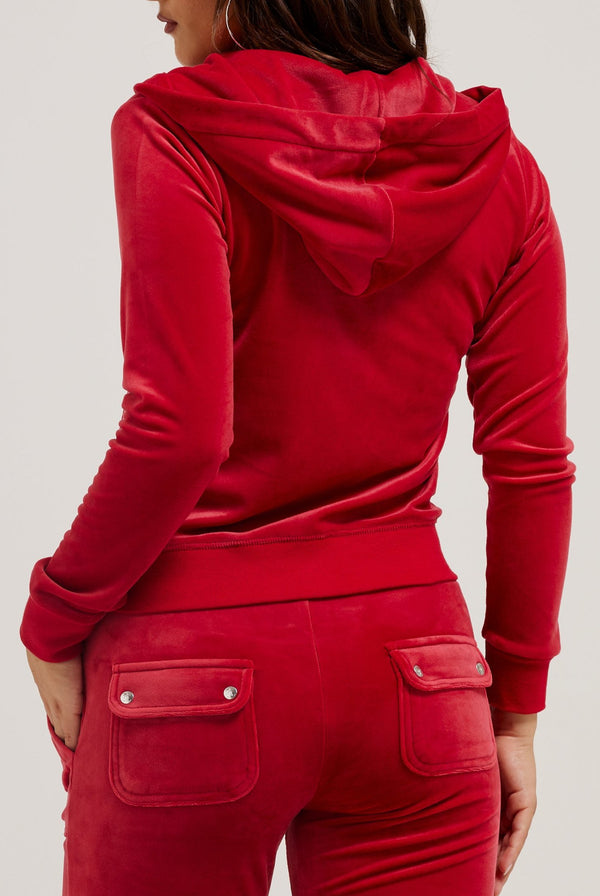 Displays a model wearing the Astor Red 'Juicy' branded classic velour Robertson hoodie 
