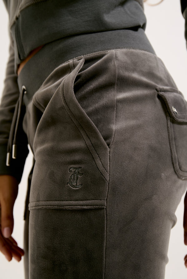 Displays a model wearing the Top Hat 'Juicy' branded classic velour del ray pocketed bottoms 